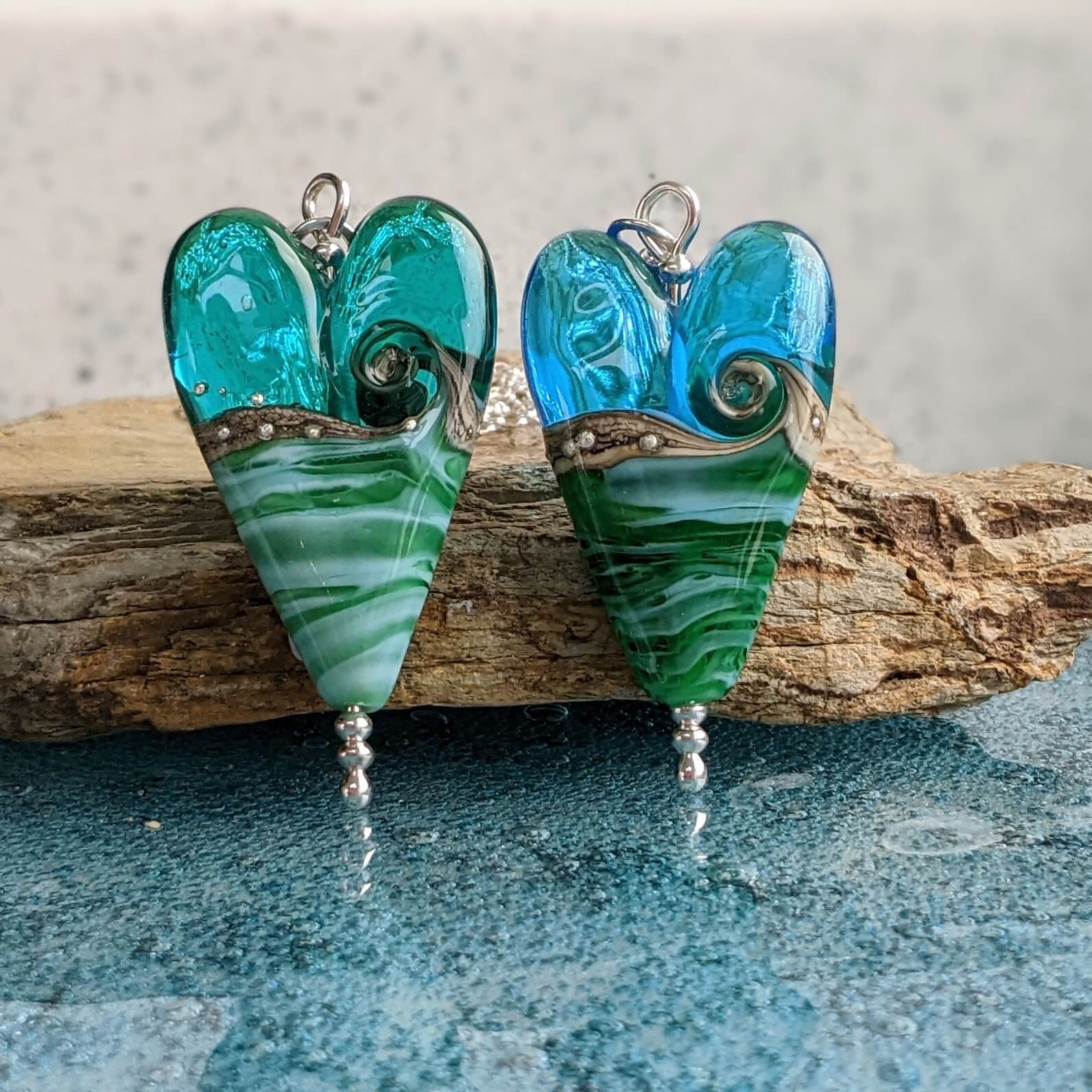 Sea glass jewelry- Beach shops stone with heart carving filled with a Salt water pearl, Aqua blue crystal bead and Cobalt blue sea glass